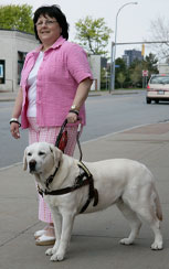 Photo of woman with seeing eye dog